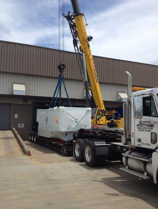 crane moving equipment on semi trailer